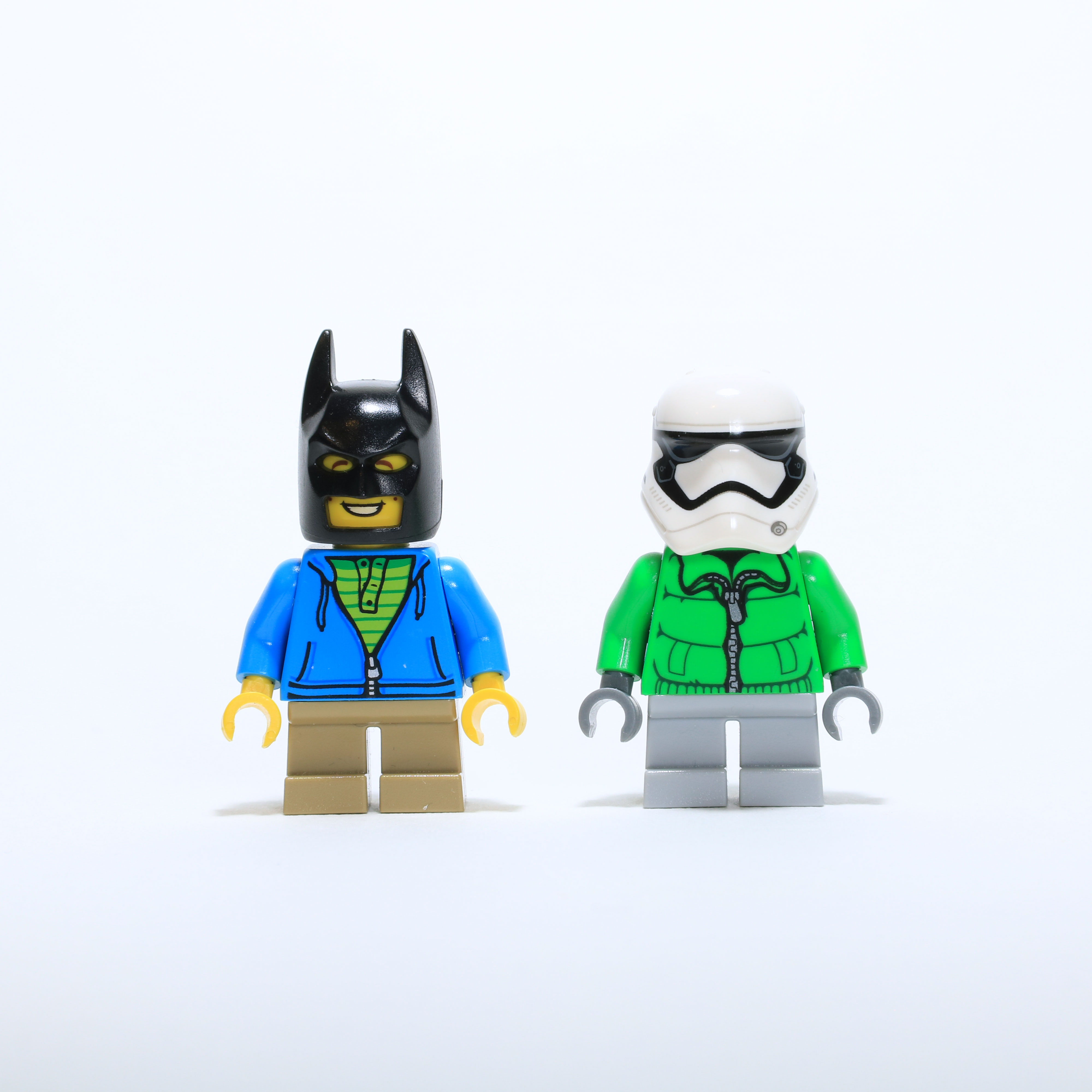 Children LEGO minifigs wearing a storm trooper helment and a batman helment